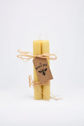 A trio of hand rolled pure beeswax candles.